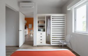 Postel nebo postele na pokoji v ubytování Azura Boutique Hotel