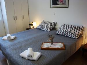 Кровать или кровати в номере Apartments Olea