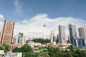 a view of a city skyline with the space needle at Prescott Hotel Kuala Lumpur Medan Tuanku in Kuala Lumpur