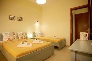 Postel nebo postele na pokoji v ubytování Hotel Dimoula