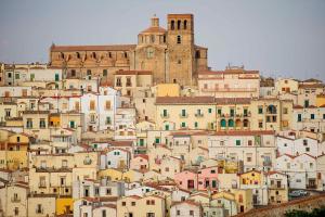 a bunch of buildings on a hill with a castle at Dimora San Pietro in Ferrandina