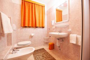 Een badkamer bij La Bastiana Apartments