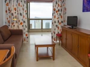 a living room filled with furniture and a tv at Gemelos 2 - Beninter in Benidorm