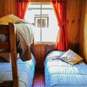Postel nebo postele na pokoji v ubytování Cabañas y Domos Doña Betty