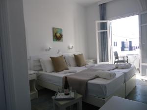 A bed or beds in a room at Vavanos Studios