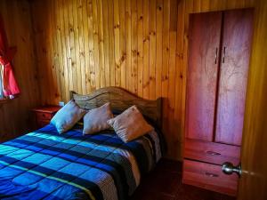Postel nebo postele na pokoji v ubytování Cabañas y Domos Doña Betty