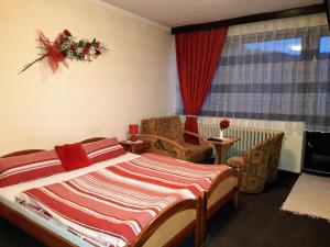 Postel nebo postele na pokoji v ubytování Penzion u Šimona