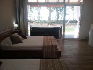 Postel nebo postele na pokoji v ubytování Cahuita Inn