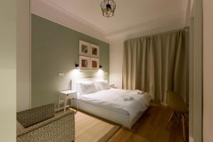 Posteľ alebo postele v izbe v ubytovaní Dinostratus House