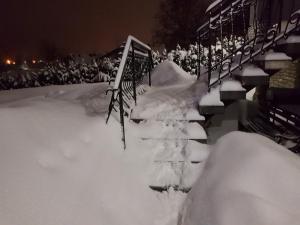 a pile of snow next to a stadium at Biały Domek in Szczyrk
