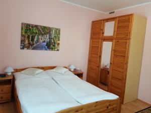 Posteľ alebo postele v izbe v ubytovaní Biały Domek