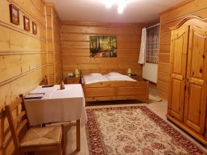 Posteľ alebo postele v izbe v ubytovaní Biały Domek