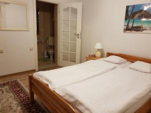 Posteľ alebo postele v izbe v ubytovaní Biały Domek