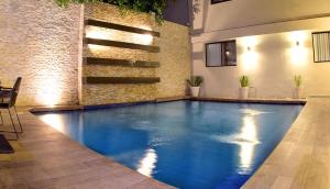 a swimming pool in the middle of a building at Antaris Valle in Monterrey