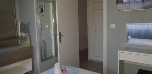 a bathroom with a toilet and a sink and a mirror at Palm beach Cannes Azur in Cannes