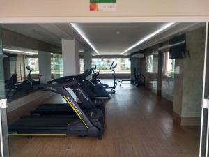 a gym with several treadmills and cardio machines at Salinas Park Resort in Salinópolis