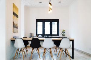 a dining room with a table and four chairs at In Homs 26 in Klang
