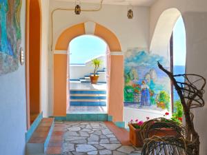 an archway in a building with a painting on the wall at Hotel Costa Diva in Praiano