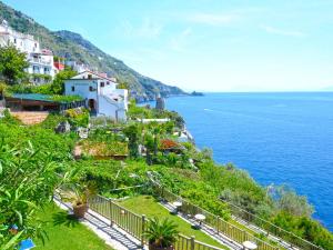 a town on a hill next to the ocean at Hotel Costa Diva in Praiano