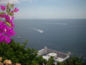 a view of the ocean with a boat in the water at Hotel Costa Diva in Praiano