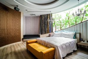 Postel nebo postele na pokoji v ubytování Shu Xin Motel