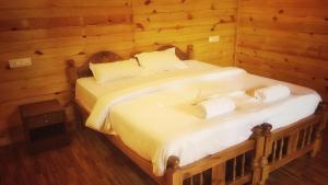 Postel nebo postele na pokoji v ubytování Palolem Luxuries Beach Cottages