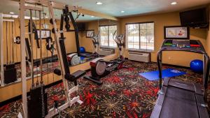 a fitness room with treadmills and elliptical machines at Best Western Kenosha Inn in Broken Arrow