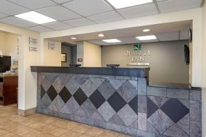 a lobby of a waiting room with a counter at Quality Inn & Suites Lafayette I-65 in Lafayette