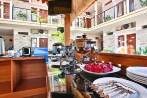 a kitchen with plates of food on a counter at Sandy's Homestay in Banyuwangi
