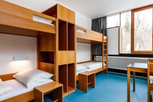 Postel nebo postele na pokoji v ubytování Jugendherberge Possenhofen