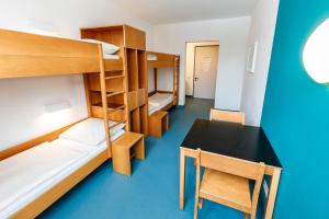 Postel nebo postele na pokoji v ubytování Jugendherberge Possenhofen