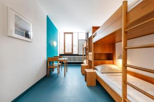 Postel nebo postele na pokoji v ubytování Jugendherberge Possenhofen