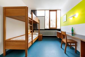 Postel nebo postele na pokoji v ubytování Jugendherberge Possenhofen
