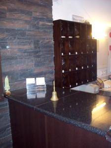 a bar in a room with a stone wall at Residência S. Francisco in Fátima