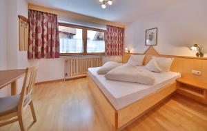 Postel nebo postele na pokoji v ubytování Haus Oberacher