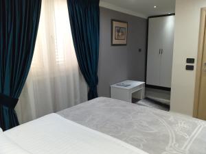 Postel nebo postele na pokoji v ubytování Hotel Erandi