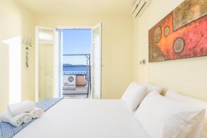 Posteľ alebo postele v izbe v ubytovaní il porto di Milos