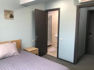 Postel nebo postele na pokoji v ubytování Dudman Hotel