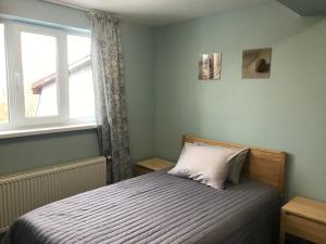 Postel nebo postele na pokoji v ubytování Dudman Hotel