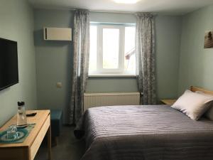 Postel nebo postele na pokoji v ubytování Dudman Hotel