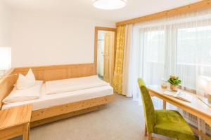 Łóżko lub łóżka w pokoju w obiekcie Hotel Pension Sonnleiten