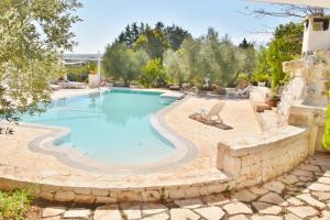 The swimming pool at or close to Trullo Cime Bianche