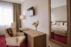 Postel nebo postele na pokoji v ubytování Hotel Alkor