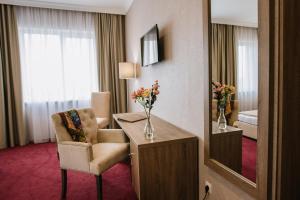 TV a/nebo společenská místnost v ubytování Hotel Alkor