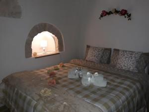 A bed or beds in a room at Trulletto dei sogni
