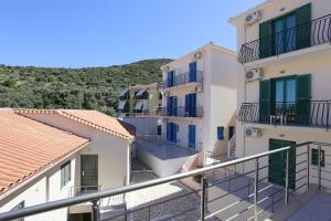 a group of buildings with balconies on the side at Ithaca's Poem Apartments in Vathi, Ithaka