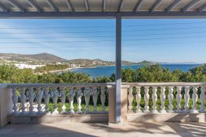 a balcony with a view of the ocean at Seashore Villa in Tinos Town