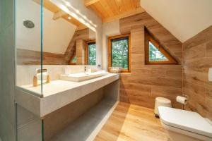 a bathroom with a sink and a toilet at ZAKOPIANA in Zakopane +32 photos