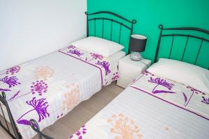 Postel nebo postele na pokoji v ubytování Apartments Šolta