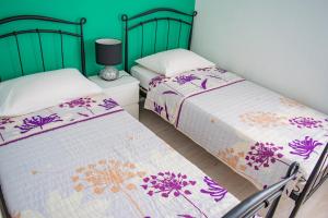 Postel nebo postele na pokoji v ubytování Apartments Šolta + 37 fotografií